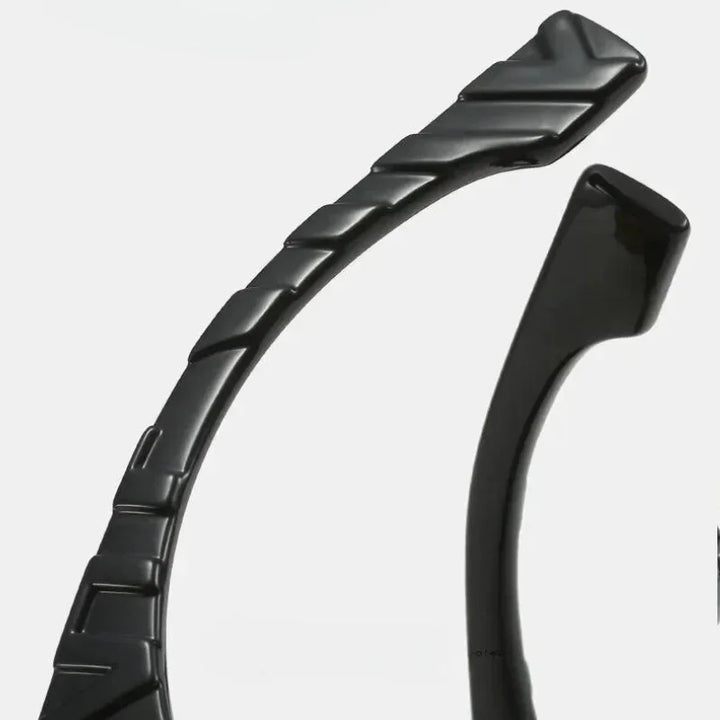 Close-up of two black plastic headbands against a white background, one with a ridged, textured surface and the other with a smooth, plain finish—ideal for pairing with vintage sunglasses featuring UV400 protection.