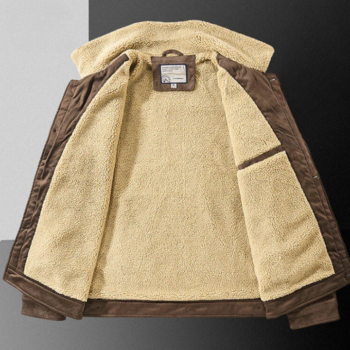 A brown jacket with a structured fit and soft Sherpa lining is laid open on a black and white background, revealing the cozy interior and multiple secure pockets.