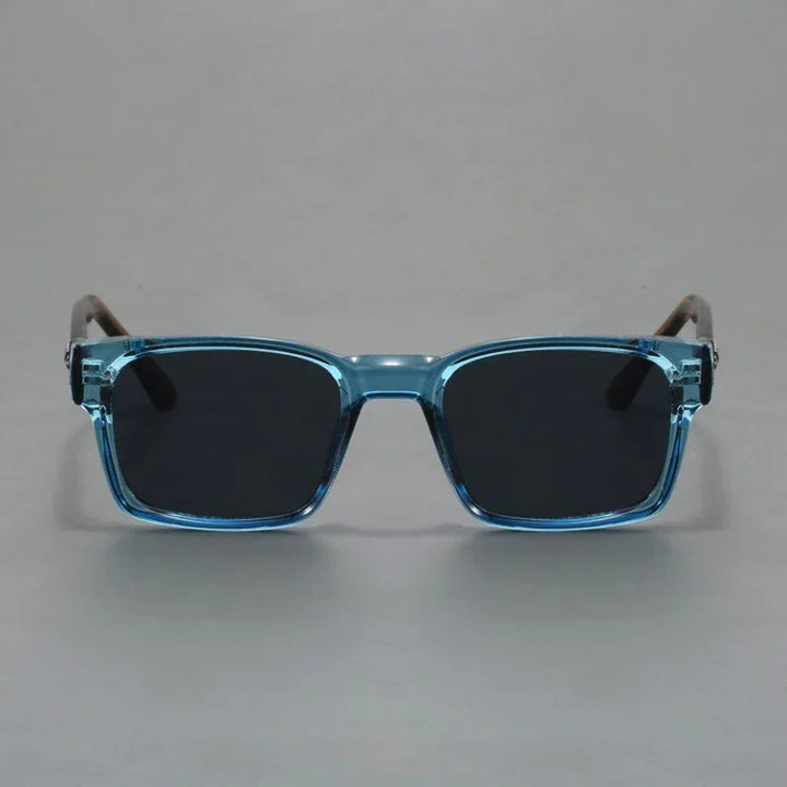 A pair of rectangular sunglasses with light blue translucent, durable frames and black lenses, offering UV400 protection, shown against a plain gray background.