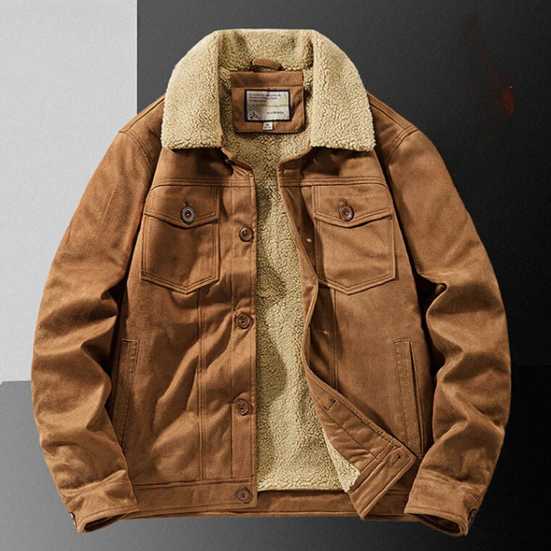 Brown suede jacket with a structured fit, cream-colored Sherpa lining and collar, buttoned front, multiple secure pockets, laid flat on a gray and white background.