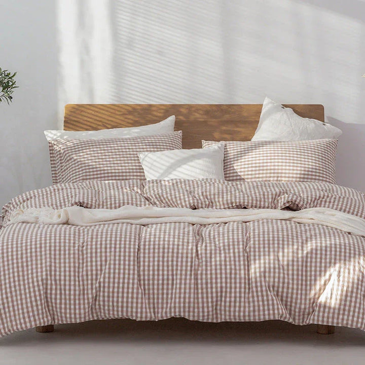 Rovelli beige gingham bedding set with pillows on a wooden bed in bright bedroom