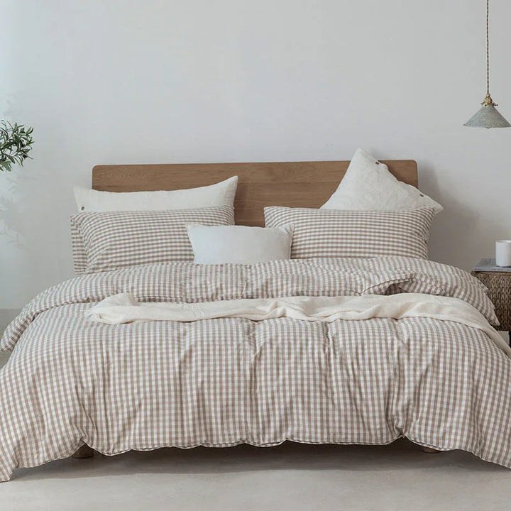 Rovelli beige gingham bedding set on wooden bed with neutral decor and cozy pillows