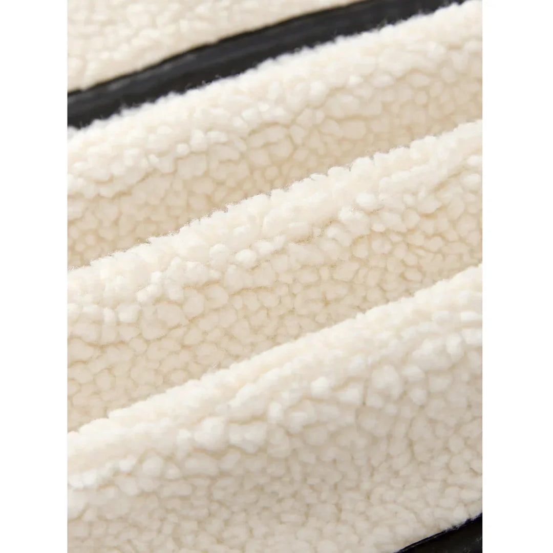 Close-up of Rovelli cream sherpa fleece fabric with soft textured surface
