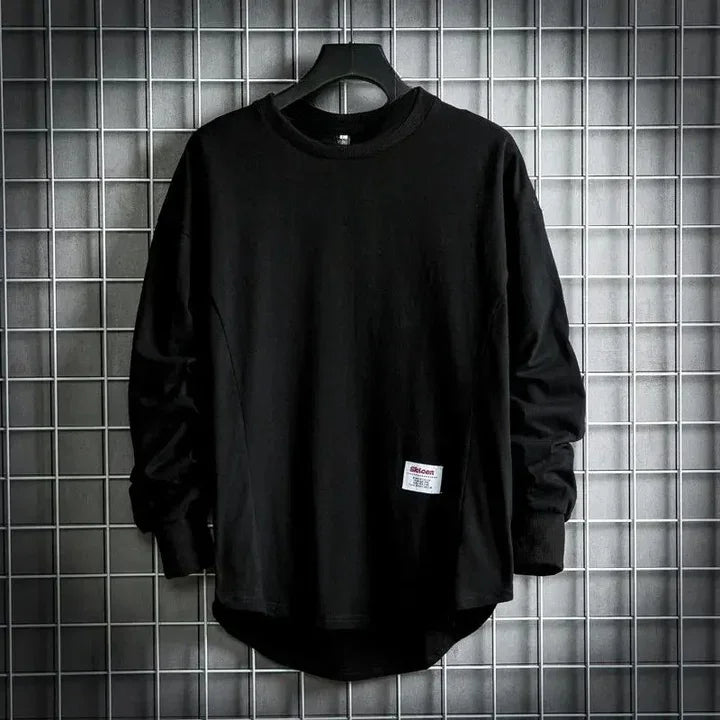 Rovelli black long sleeve shirt with logo patch on hanger against grid wall
