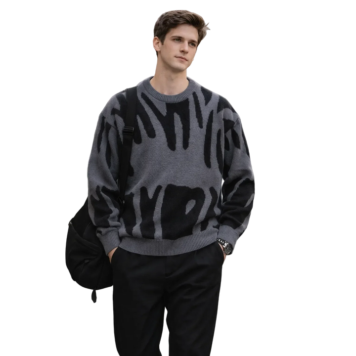 Man in gray abstract pattern sweater, black pants, and backpack, Rovelli fashion style