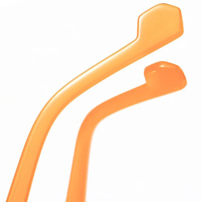 Close-up of two curved, orange plastic objects with angular ends, resembling the arms of Hexagonal Frame Sunglasses. They stand parallel in different sizes against a white background.