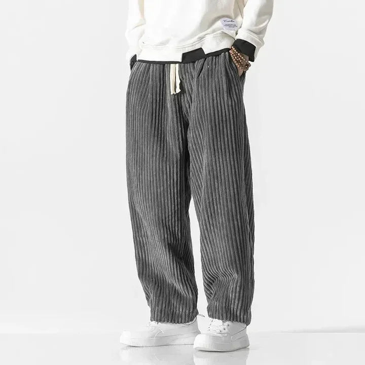 Rovelli gray corduroy drawstring pants with white sneakers and casual white sweatshirt