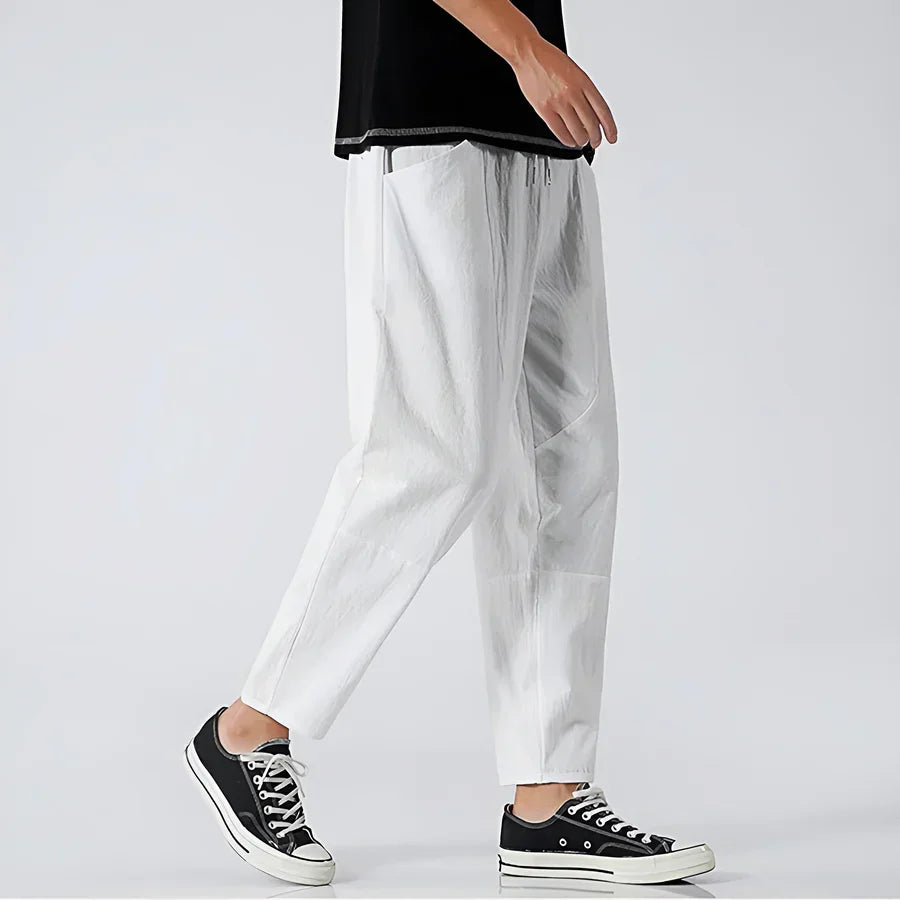 Rovelli white cropped pants for men, relaxed fit, styled with black sneakers and black shirt