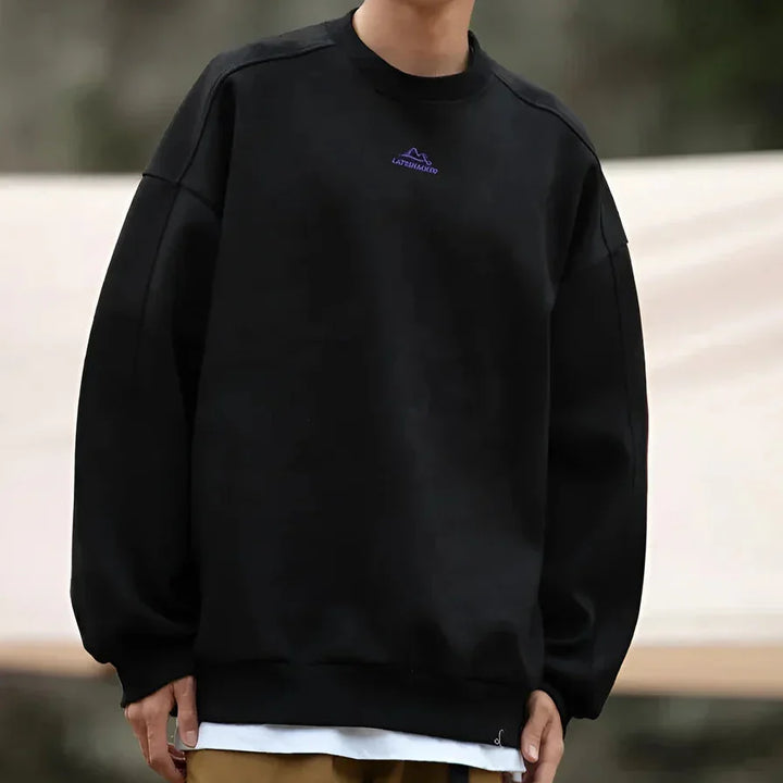 Rovelli black oversized sweatshirt with small purple logo, casual outdoor fashion