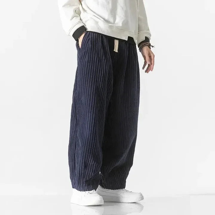 Rovelli relaxed fit navy corduroy pants with drawstring, styled with white sneakers