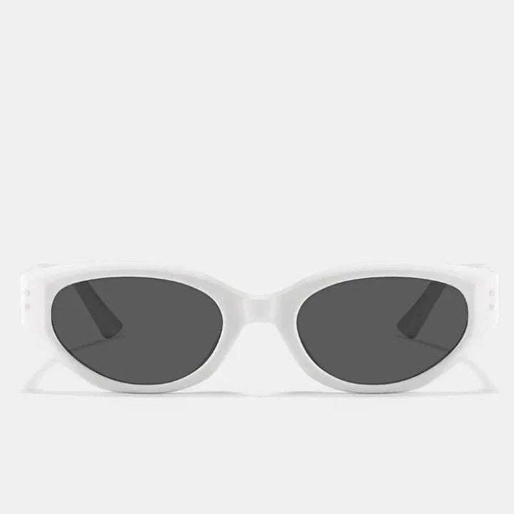 A pair of oval-shaped sunglasses with a translucent acetate frame and dark, scratch-resistant lenses, displayed against a plain light gray background.