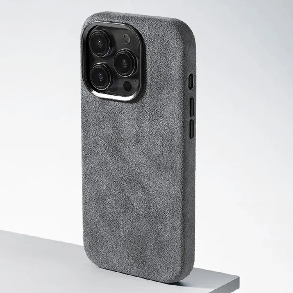 A phone case with four cameras, featuring a protective design and a luxurious suede finish.