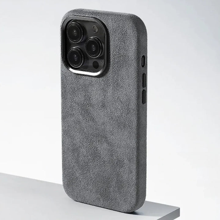 A phone case with four cameras, featuring a protective design and a luxurious suede finish.