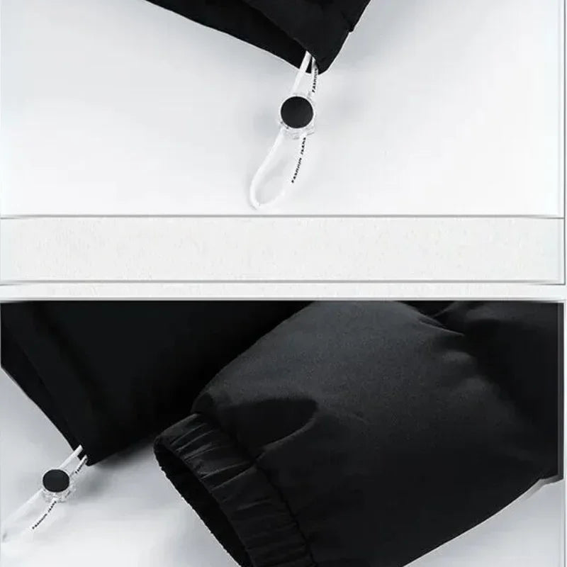 Close-up of a black jacket sleeve featuring a white adjustable drawcord with a black circular toggle and elastic cuff, displayed on a white surface. The jacket boasts premium insulation for added warmth.