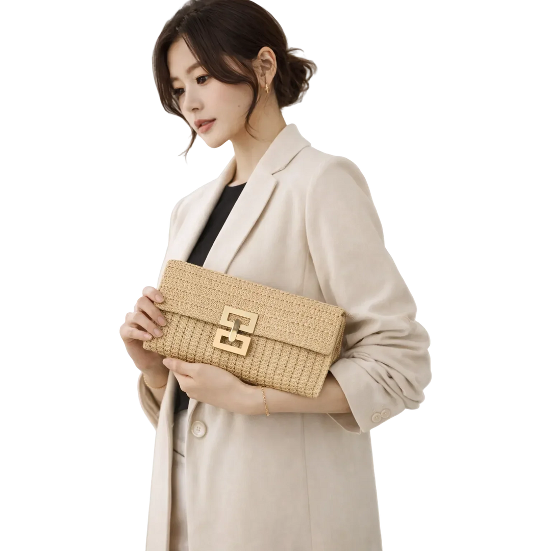 Woman in beige blazer holding Rovelli woven clutch bag with gold buckle