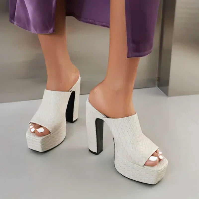 Woman wearing beige woven leather platform sandals by Rovelli, open toe, chunky high heel