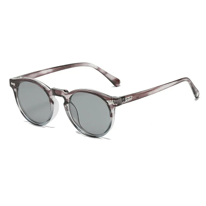 Round frame sunglasses with transparent gray frames and dark tinted lenses, offering UV400 protection, displayed on a white background at an angle showing both the front and side of the glasses.