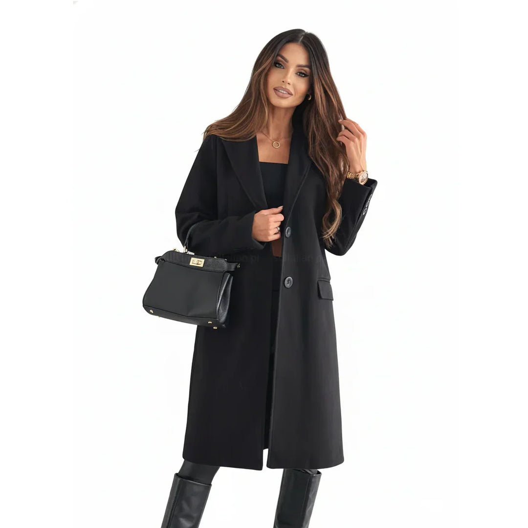 Woman wearing stylish black coat and boots, holding handbag, Rovelli fashion homepage