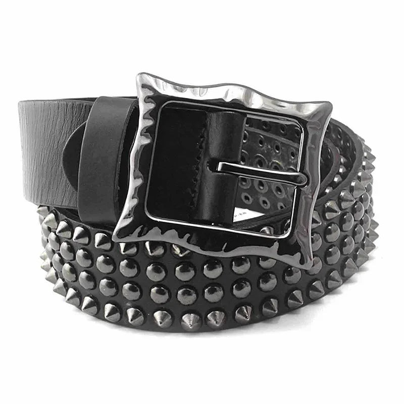 A black leather belt with studded detailing, a large, shiny square adjustable buckle, and rows of metal studs and spikes along its length for an edgy punk style.