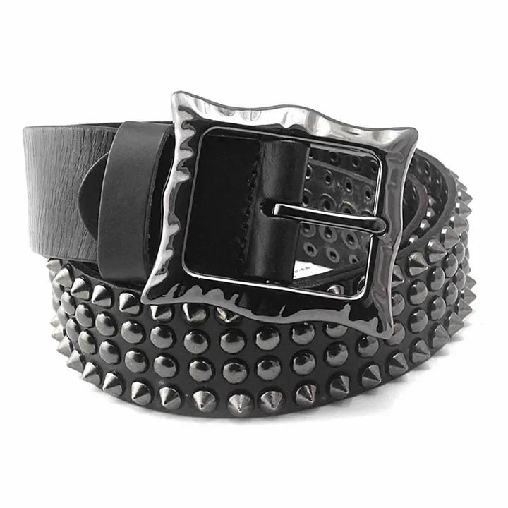 A black leather belt with studded detailing, a large, shiny square adjustable buckle, and rows of metal studs and spikes along its length for an edgy punk style.