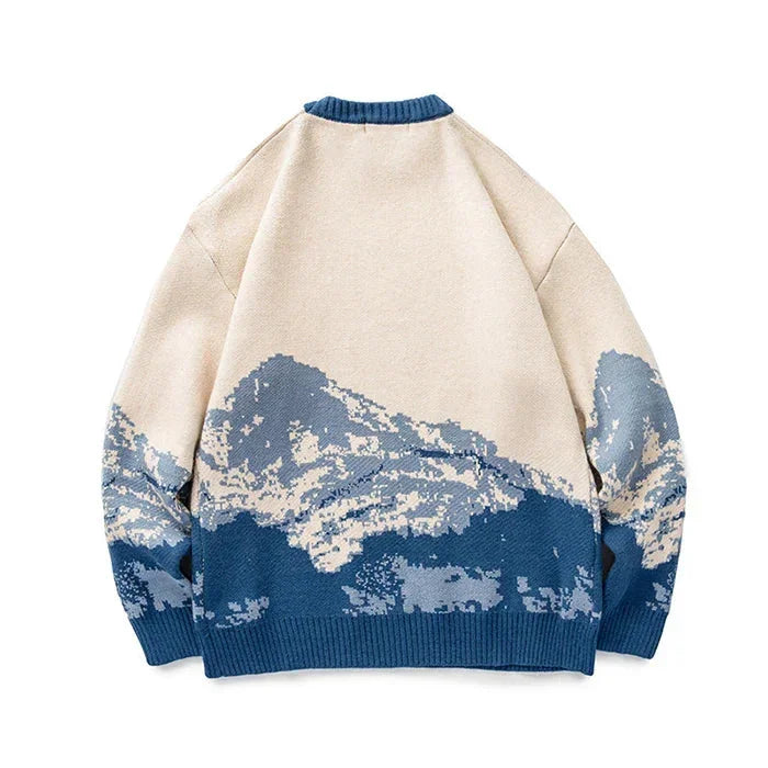 Rovelli beige sweater with blue mountain graphic design on back, cozy knitwear