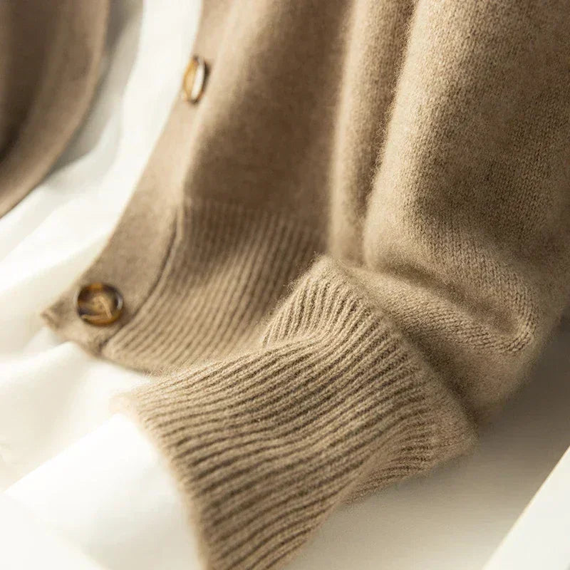 Rovelli beige wool sweater sleeve and button detail on white background