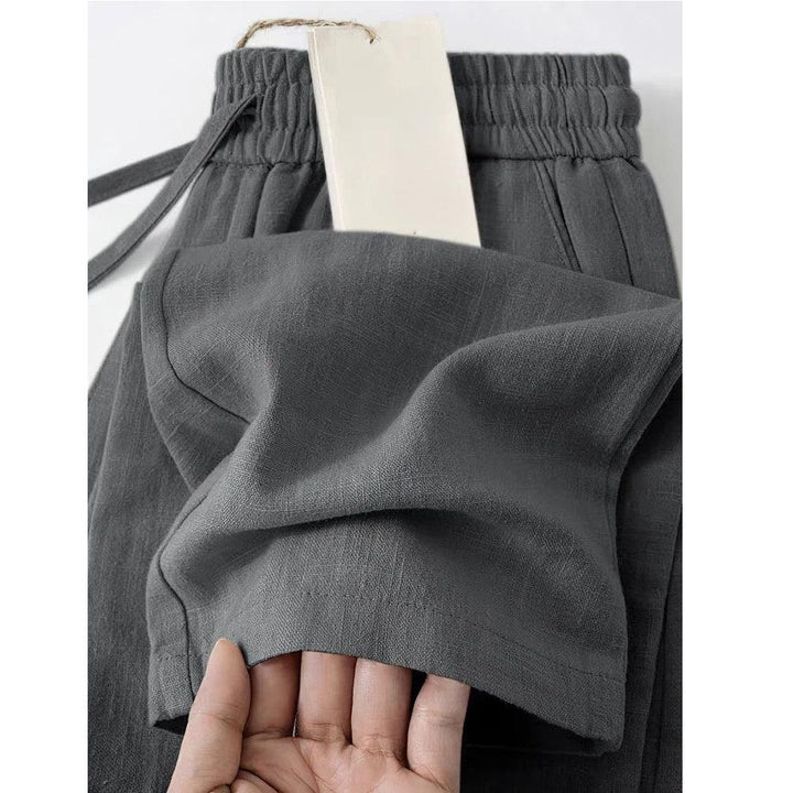 Rovelli dark grey linen pants with elastic waistband and visible front pocket detail