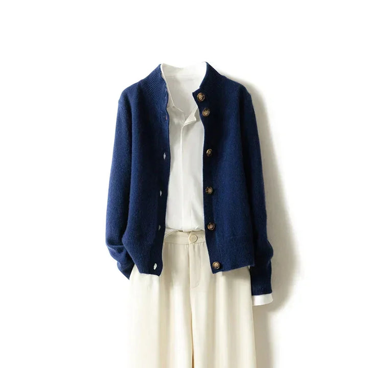 Rovelli navy blue cardigan over white blouse and beige pants, minimalist fashion style