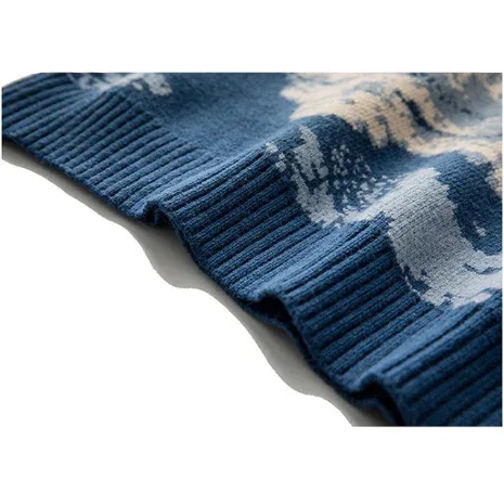 Close-up of blue knit sweater hem with abstract white pattern, Rovelli fashion apparel