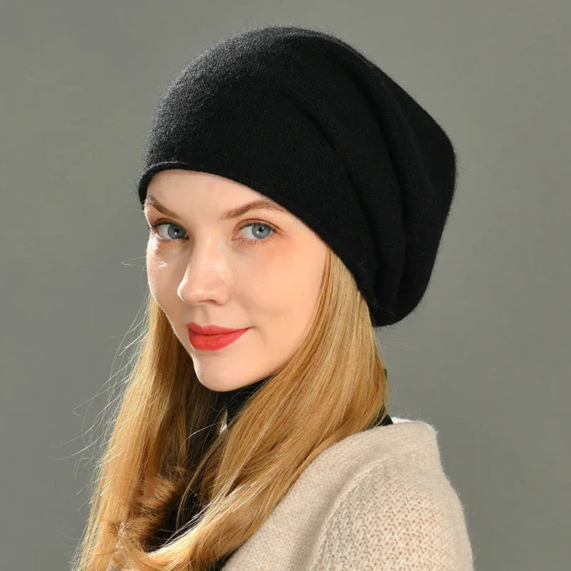 Woman wearing black beanie hat with blonde hair, Rovelli fashion accessory