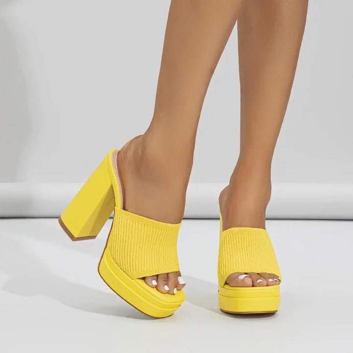 Rovelli yellow block heel platform sandals with knit upper, worn on feet, white background