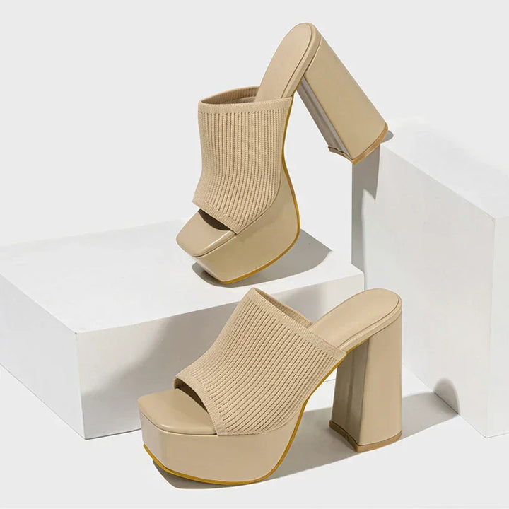 Beige platform sandals with chunky high heels from Rovelli, ribbed knit upper, studio setting.