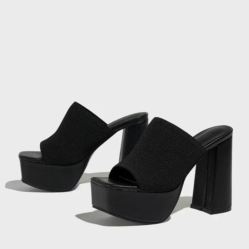 Rovelli black platform sandals with chunky high heels and knit uppers on white background