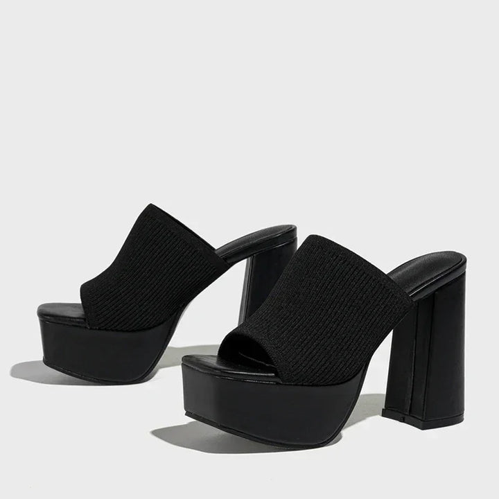 Rovelli black platform sandals with chunky high heels and knit uppers on white background
