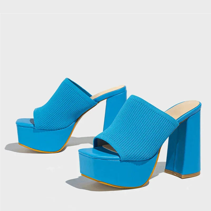 Bright blue platform sandals with chunky high heels, knit upper, product for Rovelli.