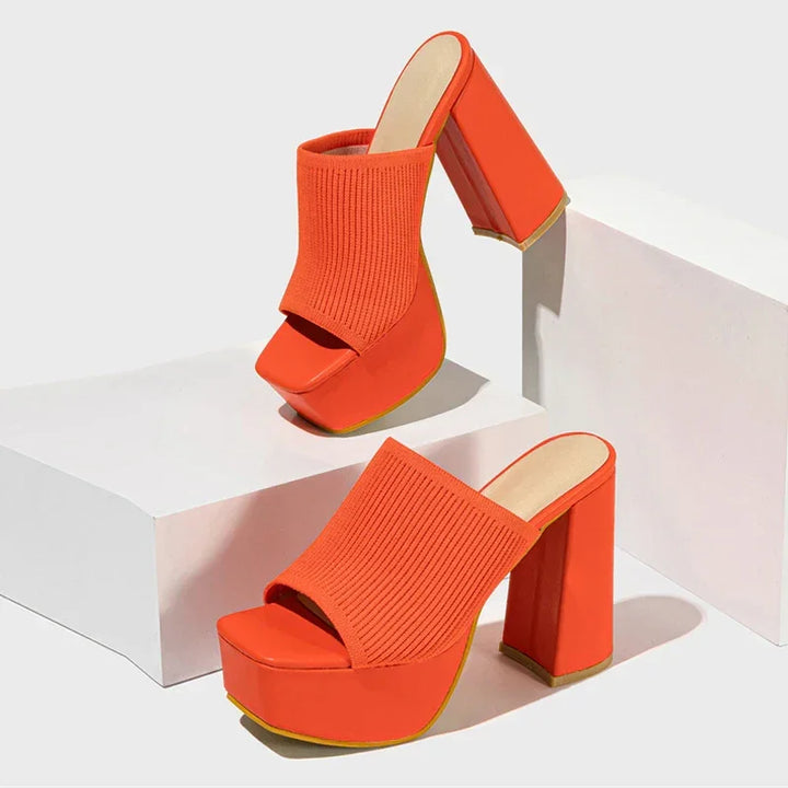 Rovelli orange platform sandals with chunky high heels and ribbed fabric uppers on display blocks