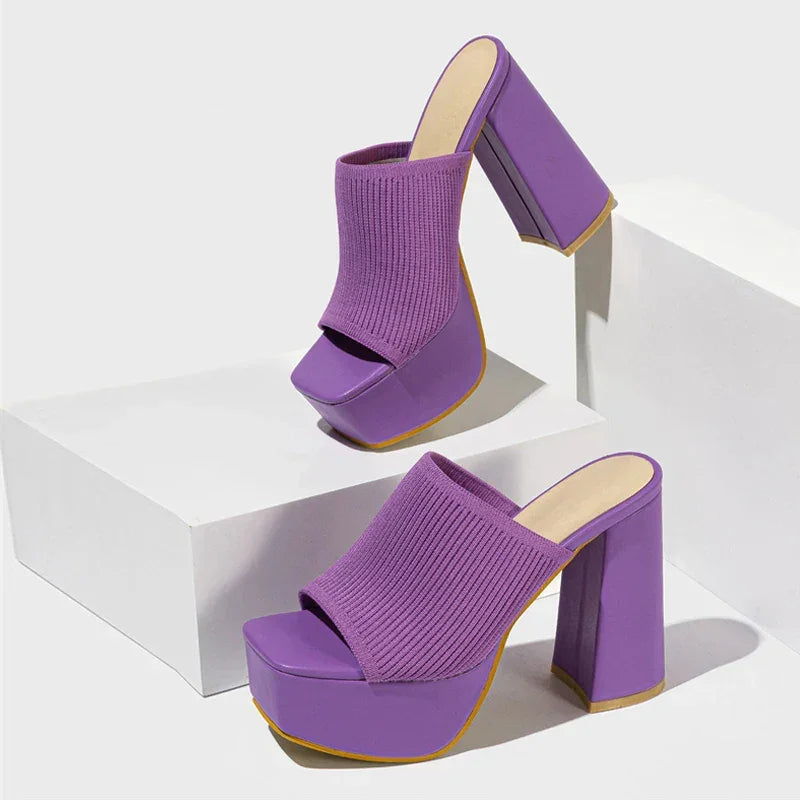 Rovelli purple platform sandals with chunky high heels and ribbed knit upper on display blocks