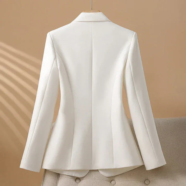 Rovelli white tailored blazer on hanger against beige background