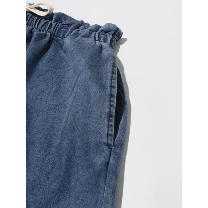 Blue denim drawstring pants with elastic waistband, casual Rovelli jeans detail