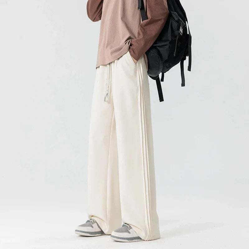 Rovelli wide leg cream pants with drawstring, paired with brown top and sneakers