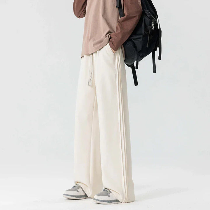 Rovelli wide leg cream pants with drawstring, paired with brown top and sneakers