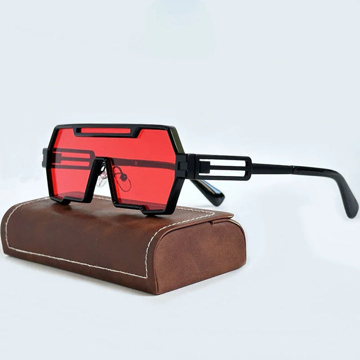 A pair of futuristic, Heavy Metal Sunglasses with bold, geometric square frames and red lenses rests on a brown leather case with white stitching, set against a light background.