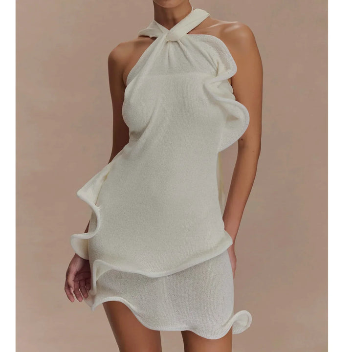 Rovelli white halter neck mini dress with wavy ruffle detail on neutral background