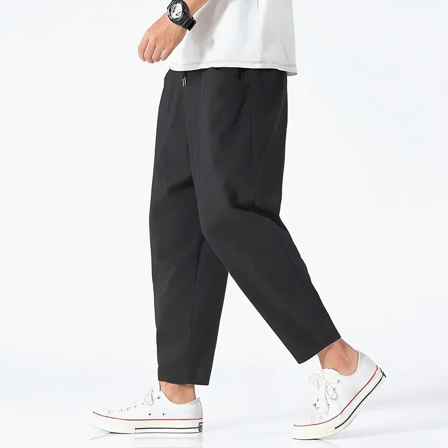 Rovelli casual black cropped pants with white sneakers and a white shirt
