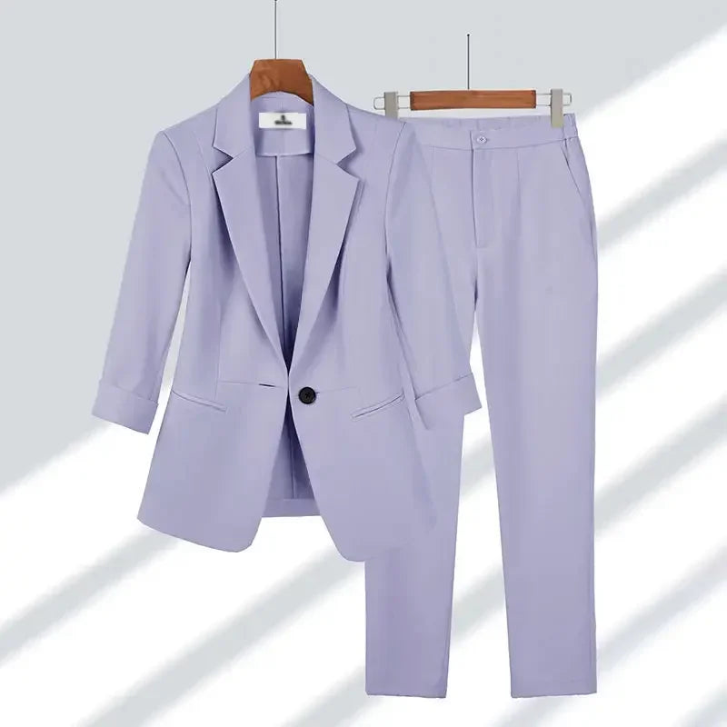 Light purple women's blazer and pants suit set on hangers, Rovelli fashion