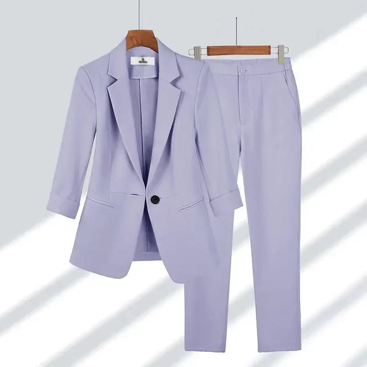 Light purple women's blazer and pants suit set on hangers, Rovelli fashion