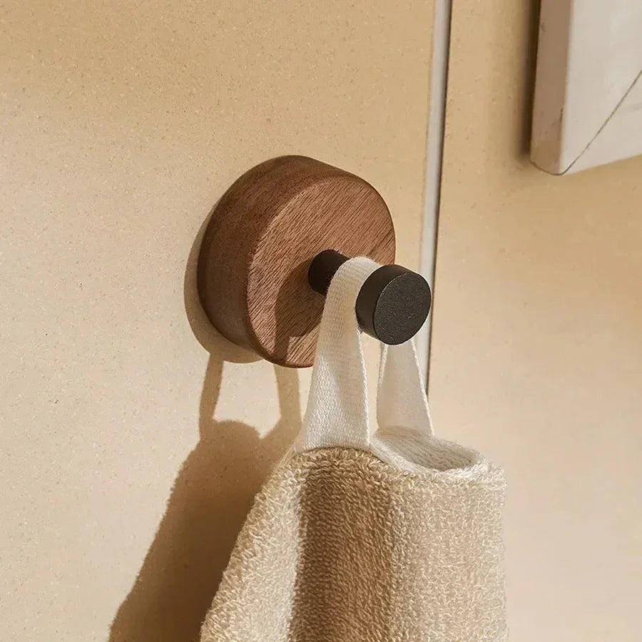 Rovelli wooden wall hook holding beige towel in modern interior