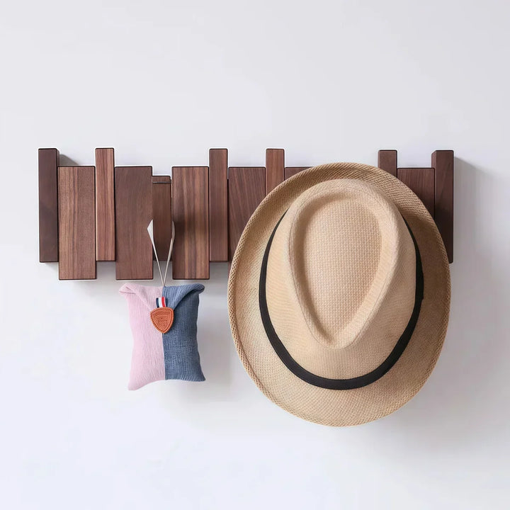 Rovelli modern wooden wall hook rack with beige hat and fabric pouch hanging
