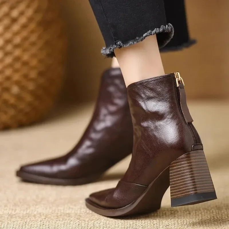 Rovelli dark brown leather ankle boots with block heel and back zipper, worn with black jeans