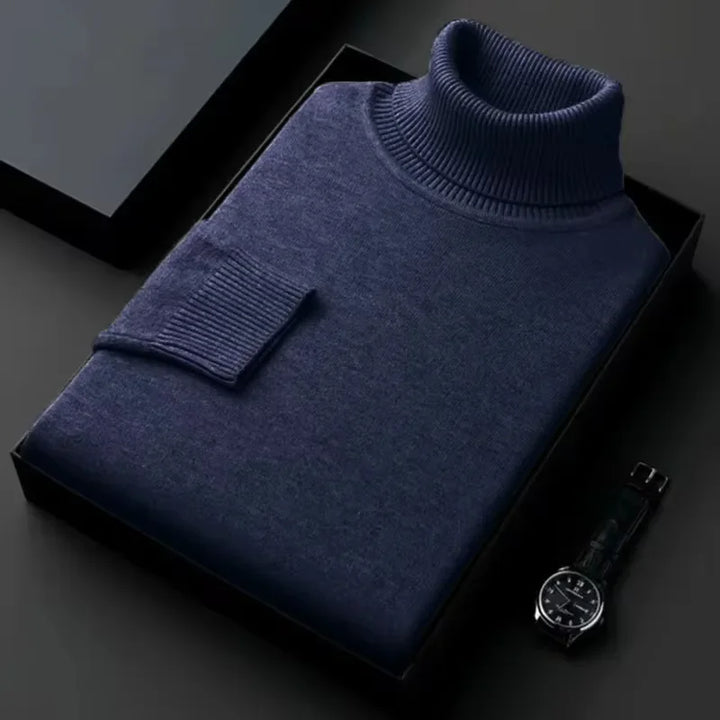 Rovelli navy blue turtleneck sweater neatly folded in a gift box, with a watch beside it